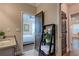 A bathroom with an open doorway to a bedroom and a decorative ladder for storage and decor at 1867 Sterling Chase, Buford, GA 30518