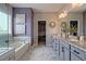 Elegant bathroom with double vanity, marble floors, and a closet perfect for keeping everything organized at 1867 Sterling Chase, Buford, GA 30518