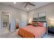 Neutral bedroom with a full length mirror and a stylish orange bed set, radiating a soothing ambiance at 1867 Sterling Chase, Buford, GA 30518