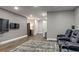 Bonus room with comfy seating and a large wall mounted television for entertainment at 1867 Sterling Chase, Buford, GA 30518