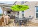 Outdoor deck features a dining area, grill, and seating, complemented by a covered deck and brick exterior at 1867 Sterling Chase, Buford, GA 30518