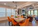 Elegant dining room featuring an eye-catching chandelier, hardwood floors, and large windows for abundant natural light at 1867 Sterling Chase, Buford, GA 30518