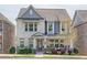 Charming two-story brick home with a covered front porch and manicured landscaping at 1867 Sterling Chase, Buford, GA 30518