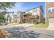 Rear exterior of home with covered deck above the two-car garage in Buford, GA at 1867 Sterling Chase, Buford, GA 30518