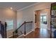 Upstairs hallway boasting hardwood floors and access to the living room at 1867 Sterling Chase, Buford, GA 30518