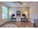 Well-lit home office featuring two desks, a ceiling fan, and a neutral color palette conducive to productivity at 1867 Sterling Chase, Buford, GA 30518