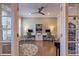 Bright home office space with a ceiling fan, two workstations, and natural light filtering through large windows at 1867 Sterling Chase, Buford, GA 30518
