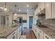 Spacious kitchen features granite countertops, stainless steel appliances, and ample cabinet space at 1867 Sterling Chase, Buford, GA 30518