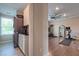 Laundry room featuring a washer and dryer unit, storage cabinets, and a window at 1867 Sterling Chase, Buford, GA 30518