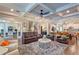 Spacious living room with hardwood floors, coffered ceiling, and an open layout at 1867 Sterling Chase, Buford, GA 30518