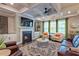 Inviting living room with a cozy fireplace, coffered ceiling, plush rug, and ample seating for relaxation at 1867 Sterling Chase, Buford, GA 30518