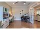 Versatile space with office area, piano, and beautiful views into a living area with lots of windows and natural light at 1867 Sterling Chase, Buford, GA 30518