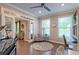 Stylish living space with a piano, comfortable seating, and a view leading to other elegantly designed rooms at 1867 Sterling Chase, Buford, GA 30518