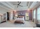 Beautiful primary bedroom suite with tray ceiling, with views to the en-suite closet and bathroom at 1867 Sterling Chase, Buford, GA 30518