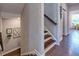 Inviting hallway with hardwood floors and a staircase leading to the upper floor at 1867 Sterling Chase, Buford, GA 30518