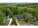 Aerial view of a luxury home surrounded by lush greenery at 3646 Sope Creek Farm Se, Marietta, GA 30067