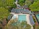 Aerial view of a large community pool and tennis court surrounded by lush greenery at 3646 Sope Creek Farm Se, Marietta, GA 30067