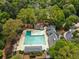 Aerial view of a community pool surrounded by mature trees and landscaping at 3646 Sope Creek Farm Se, Marietta, GA 30067