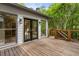 Wooden deck with black metal railings, perfect for outdoor entertaining with natural light coming through the trees at 3646 Sope Creek Farm Se, Marietta, GA 30067