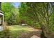 Wide shot of backyard with mature trees and natural light at 3646 Sope Creek Farm Se, Marietta, GA 30067