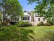 Expansive backyard featuring a combination of lush greenery and architectural features of the home at 3646 Sope Creek Farm Se, Marietta, GA 30067