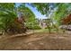 A beautifully landscaped backyard with mature trees, flowering shrubs and plenty of shade at 3646 Sope Creek Farm Se, Marietta, GA 30067