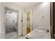 Bathroom features a marble vanity, shower, and linen closet at 3646 Sope Creek Farm Se, Marietta, GA 30067