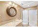 Cozy bathroom featuring a vanity, decorative mirror, and a glass-enclosed shower stall at 3646 Sope Creek Farm Se, Marietta, GA 30067