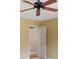 Tan bedroom featuring a white door, tan walls, and a ceiling fan at 3646 Sope Creek Farm Se, Marietta, GA 30067