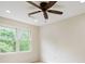 Bedroom featuring a ceiling fan and window views at 3646 Sope Creek Farm Se, Marietta, GA 30067