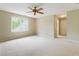 Large bedroom with neutral carpet, a window, and a ceiling fan at 3646 Sope Creek Farm Se, Marietta, GA 30067