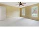 Bright and airy bedroom with neutral carpet, two windows, ceiling fan and neutral walls at 3646 Sope Creek Farm Se, Marietta, GA 30067