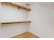 Bright closet featuring custom wood shelving and metal hanging bars offering great storage at 3646 Sope Creek Farm Se, Marietta, GA 30067