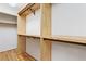 Custom closet featuring custom wood shelving and metal hanging bars providing ample storage space at 3646 Sope Creek Farm Se, Marietta, GA 30067