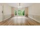 Dining room showcasing hardwood floors, decorative molding, and a bay window at 3646 Sope Creek Farm Se, Marietta, GA 30067