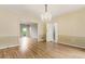 Dining room featuring hardwood floors, decorative molding, and a chandelier at 3646 Sope Creek Farm Se, Marietta, GA 30067