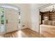 Open foyer features hardwood floors, white molding, and entrance to library at 3646 Sope Creek Farm Se, Marietta, GA 30067