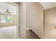 View into bedroom at the end of the hallway with a ceiling fan and natural light at 3646 Sope Creek Farm Se, Marietta, GA 30067