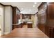 This is a kitchen with custom wood cabinets, granite countertops, and hardwood floors at 3646 Sope Creek Farm Se, Marietta, GA 30067