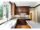 Gourmet kitchen features custom wood cabinets, granite countertops, and a farmhouse sink at 3646 Sope Creek Farm Se, Marietta, GA 30067