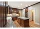 The kitchen has custom wood cabinets, granite countertops, and stainless steel appliances at 3646 Sope Creek Farm Se, Marietta, GA 30067