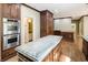 Spacious kitchen boasts custom wood cabinets, granite countertops, and stainless steel appliances at 3646 Sope Creek Farm Se, Marietta, GA 30067