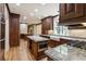 Spacious kitchen features custom wood cabinets, granite countertops, and hardwood floors at 3646 Sope Creek Farm Se, Marietta, GA 30067