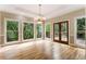 Living room with hardwood floors, chandelier, and view to outdoor deck area at 3646 Sope Creek Farm Se, Marietta, GA 30067