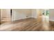 Living room featuring hardwood floors and neutral walls with large windows at 3646 Sope Creek Farm Se, Marietta, GA 30067