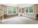 Bright living room with plenty of natural light with white trim and tan walls at 3646 Sope Creek Farm Se, Marietta, GA 30067