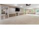 Large living room with neutral carpet and space for entertaining with attached tv at 3646 Sope Creek Farm Se, Marietta, GA 30067