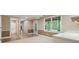 Light-filled living room area with views to the outdoors, storage, and hallway access at 3646 Sope Creek Farm Se, Marietta, GA 30067