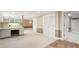 Spacious living room area with built in work-space with views to the outdoors and hallway access at 3646 Sope Creek Farm Se, Marietta, GA 30067