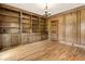 Library room featuring hardwood floors, built-in bookcases, and paneled walls at 3646 Sope Creek Farm Se, Marietta, GA 30067